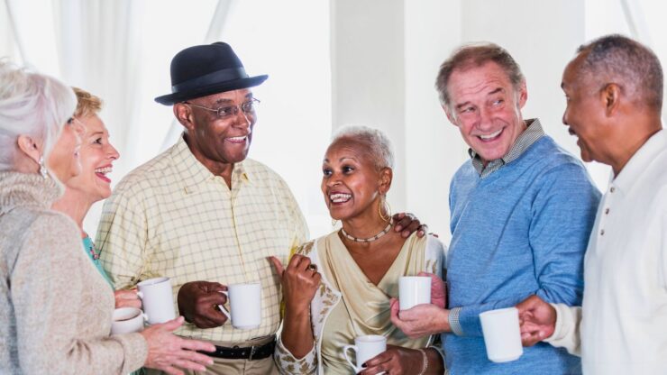 A group of seniors engaged in a conversation.